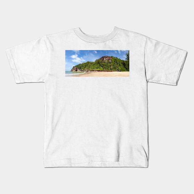 Exotic sand beach and cliffs with forest Kids T-Shirt by Juhku